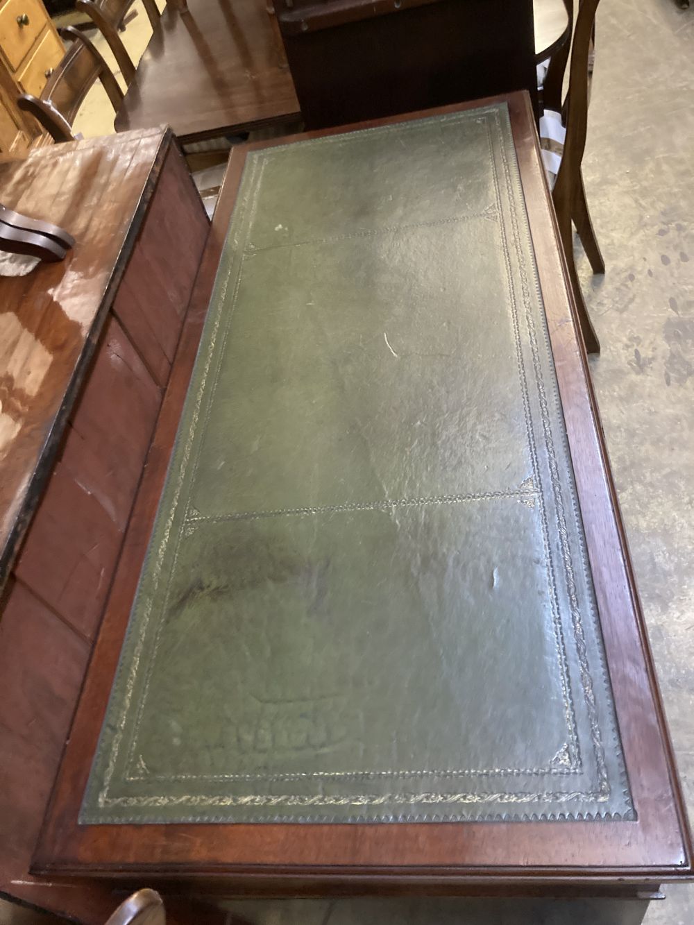 A late Victorian mahogany pedestal desk, stamped J. Shoolbred, width 122cm depth 55cm height 75cm